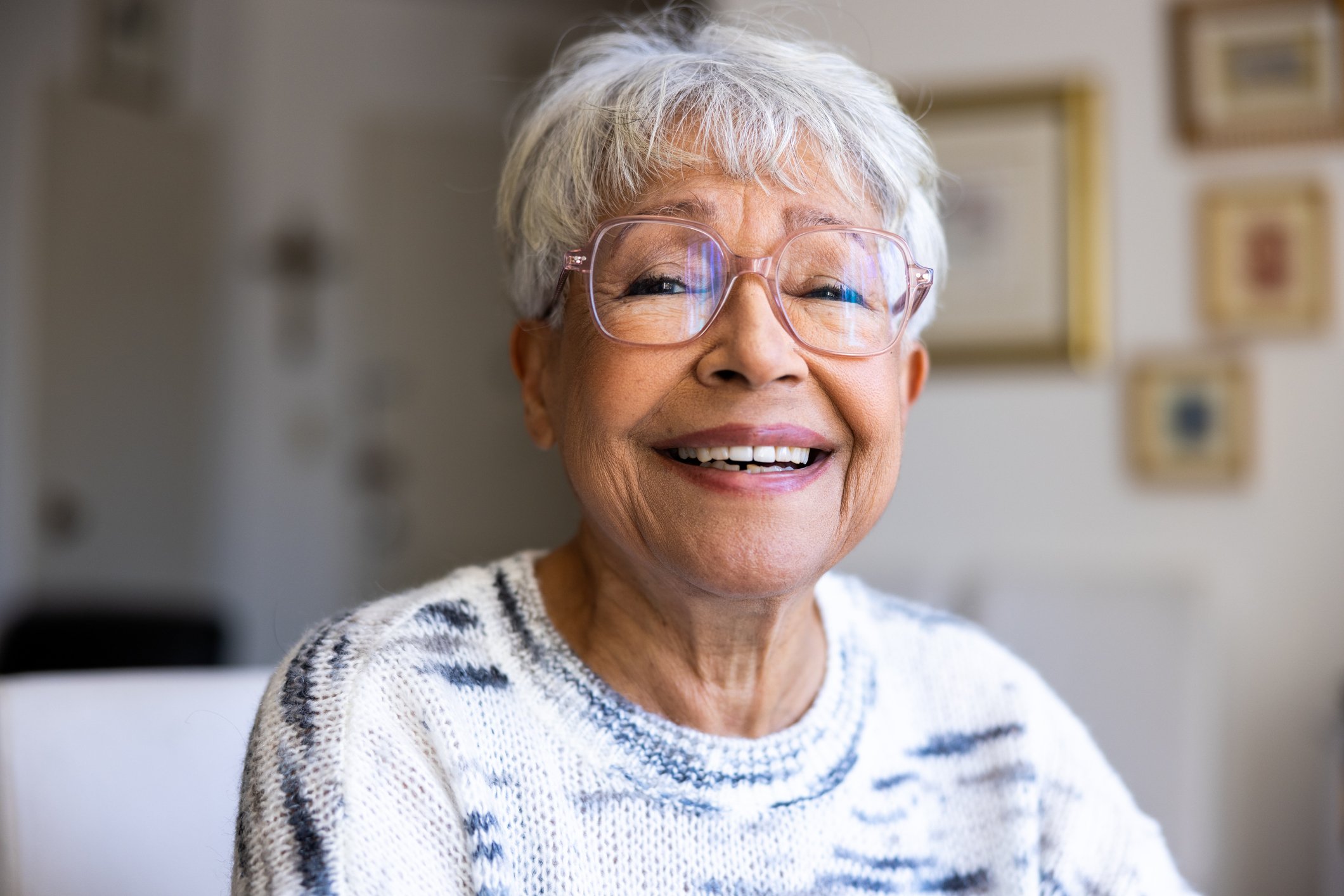 Portrait of a beautiful mixed race senior woman in her home